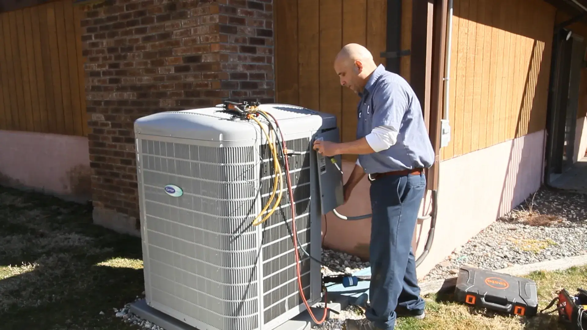 Technician installing an air conditioner