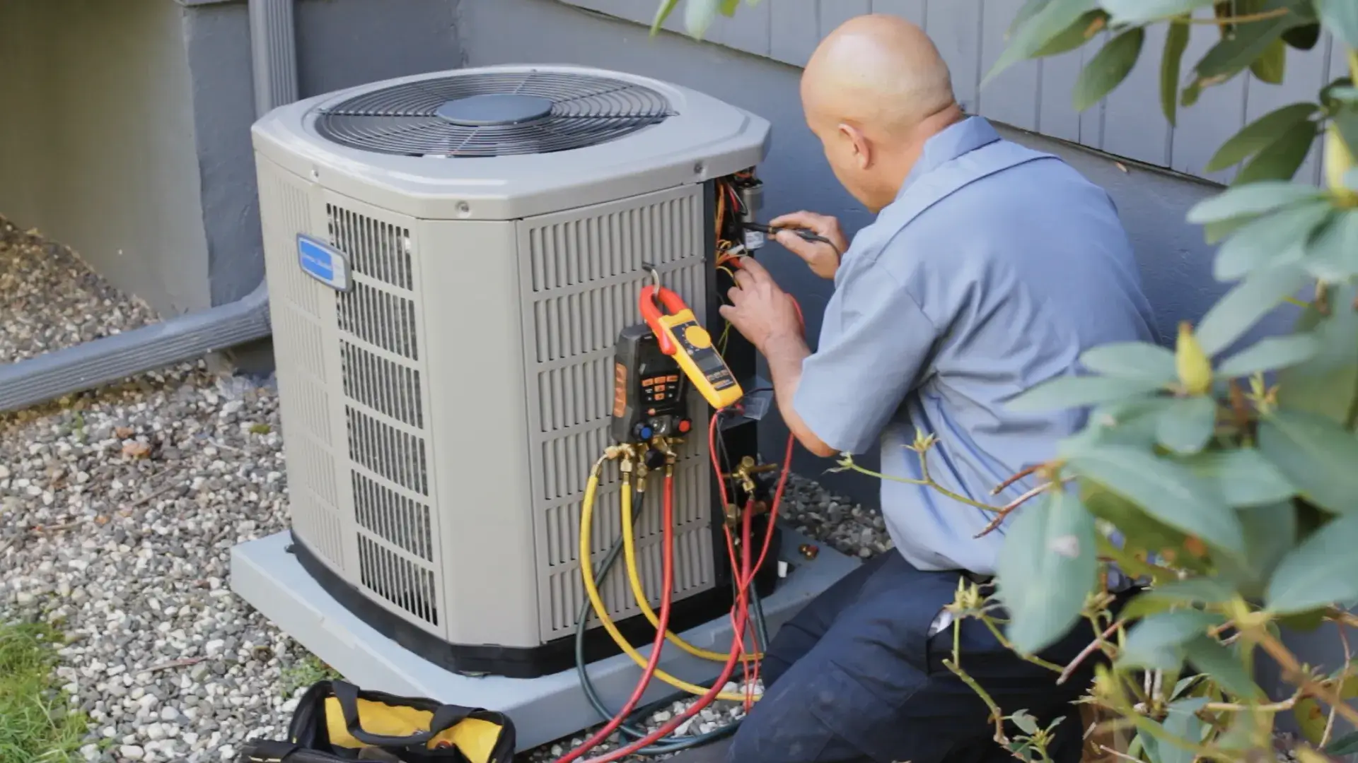 Technician working on heat pump